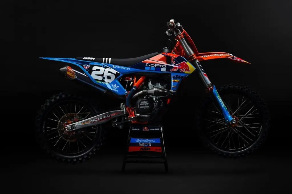 Dirt bike on a center stand showing colorful dirt bike graphics