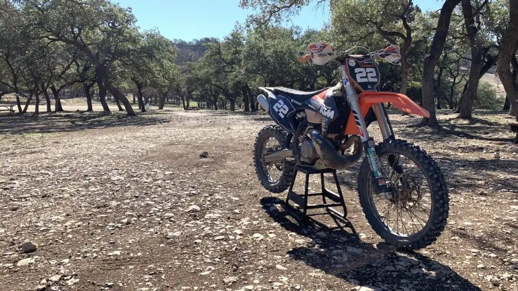 Dirt bike on a center stand ready for a tire pressure checkup