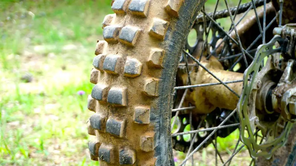 A worn out and dirty dirt bike tire after trail riding