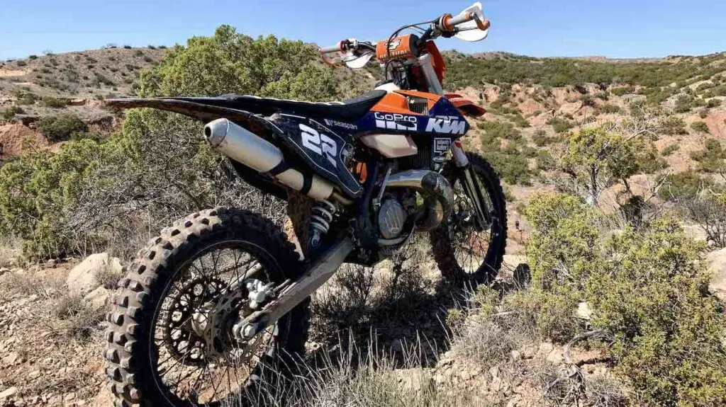 KTM dirt bike standing in a desert like environment