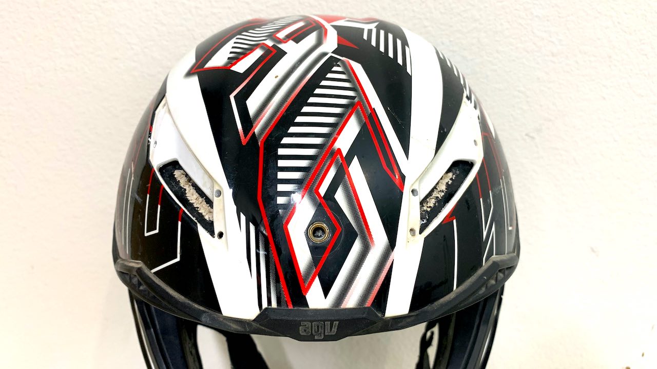 Front side of a dirt bike helmet showing air vents