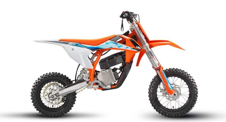 KTM SX E5 is an electric kids dirt bike with orange coloring