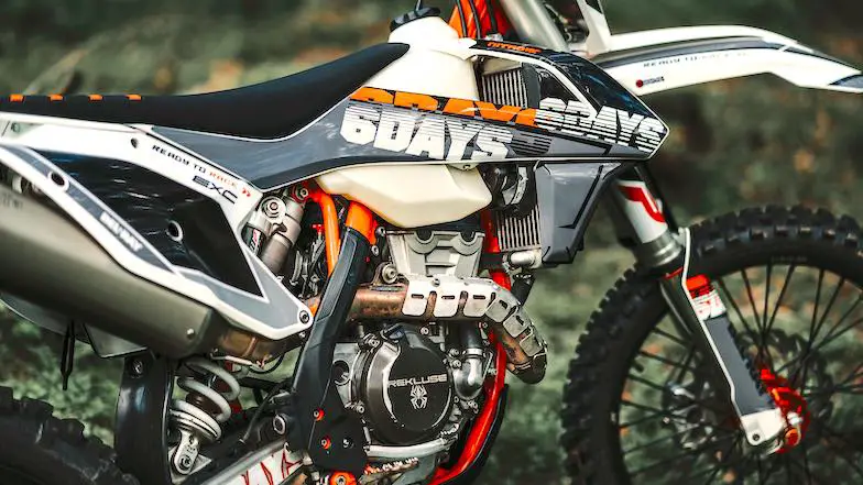 A 4 stroke with an aluminum dirt bike pipe guard attached to the head pipe