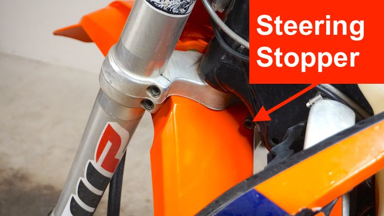 Steering stopper location on the front fork on a dirt bike