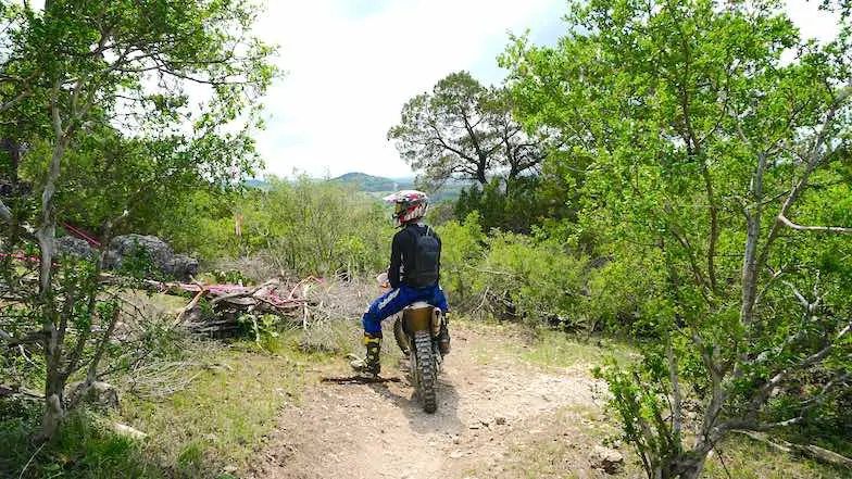A dirt rider sitting on a dirt bike on the best dirt bike trails in Austin Texas at CTOR