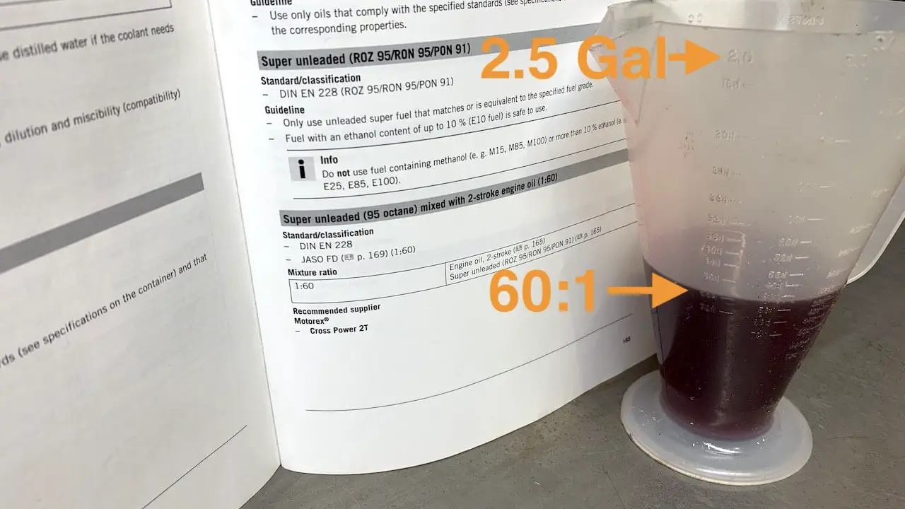2 stroke oil mix ratio on a service manual page and a 2 stroke oil measuring cup