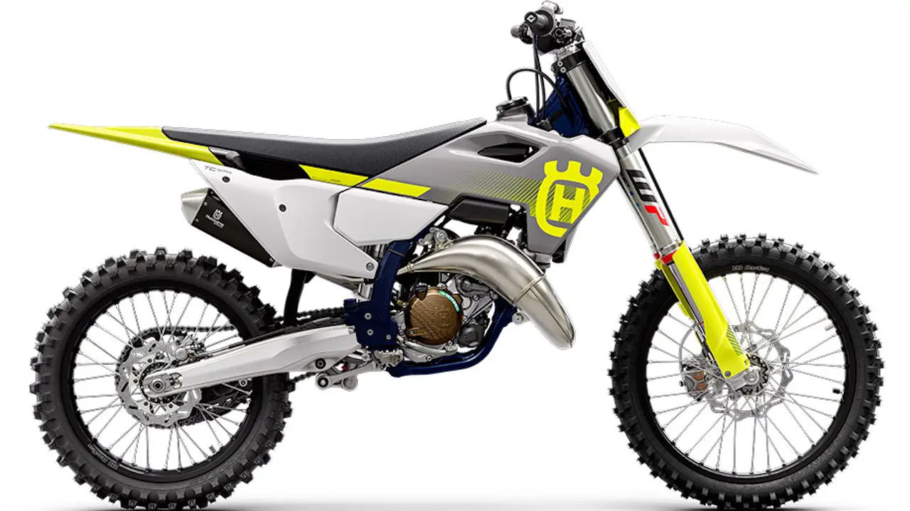 Husqvarna TC 125 on a factory floor on a white background