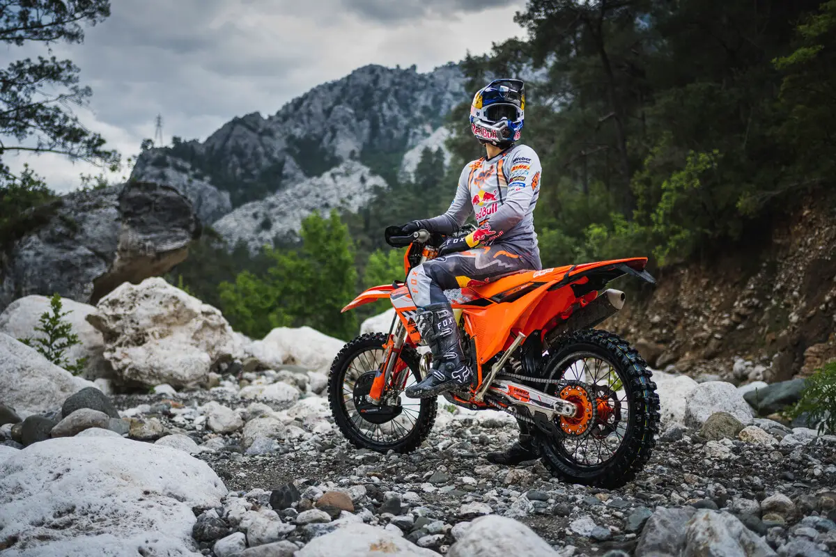 2024 KTM 300 XCW on a rocky trail with rider looking back